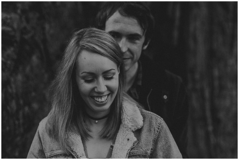 Black and white image of a couple smiling in Ayr