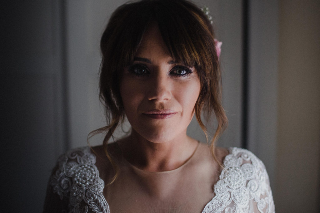 head and shoulders shot of bride looking straight to camera