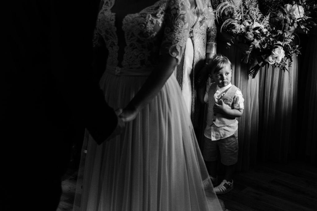 Couple's son looks at the registrar as they get married at Boswell's Coach House Ayrshire