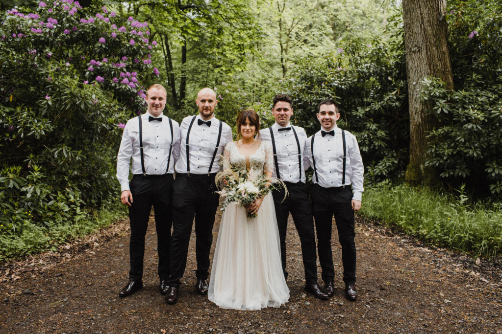 black tie groomsmen and bride in group wedding picture at Boswell's Coach House Ayrshire