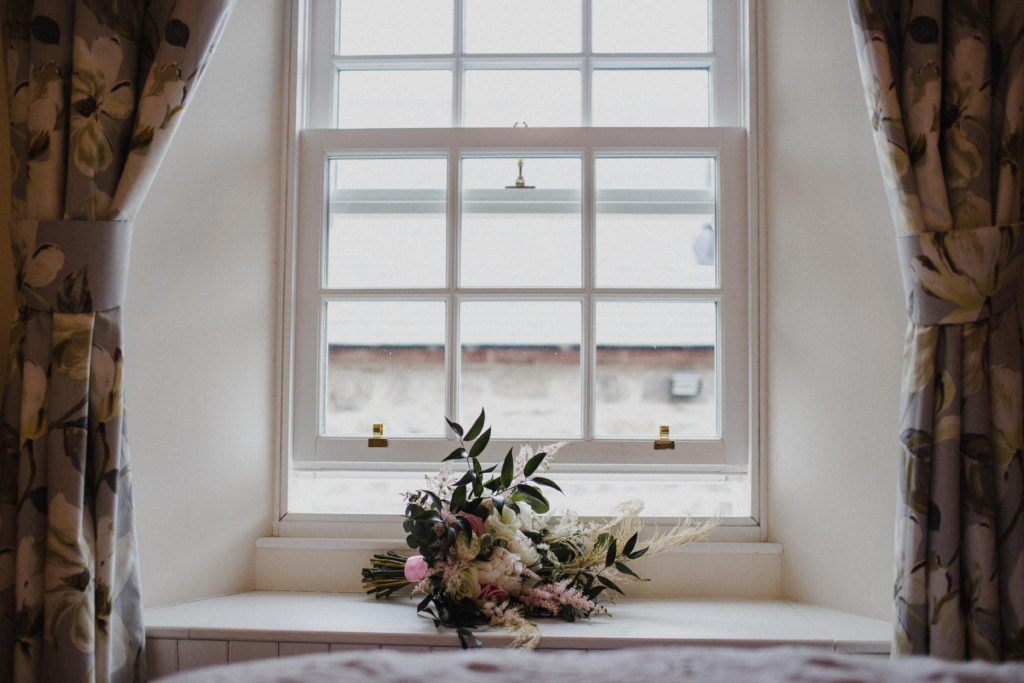 bridal bouquet in the window of Boswells Coach House in Ayrshire