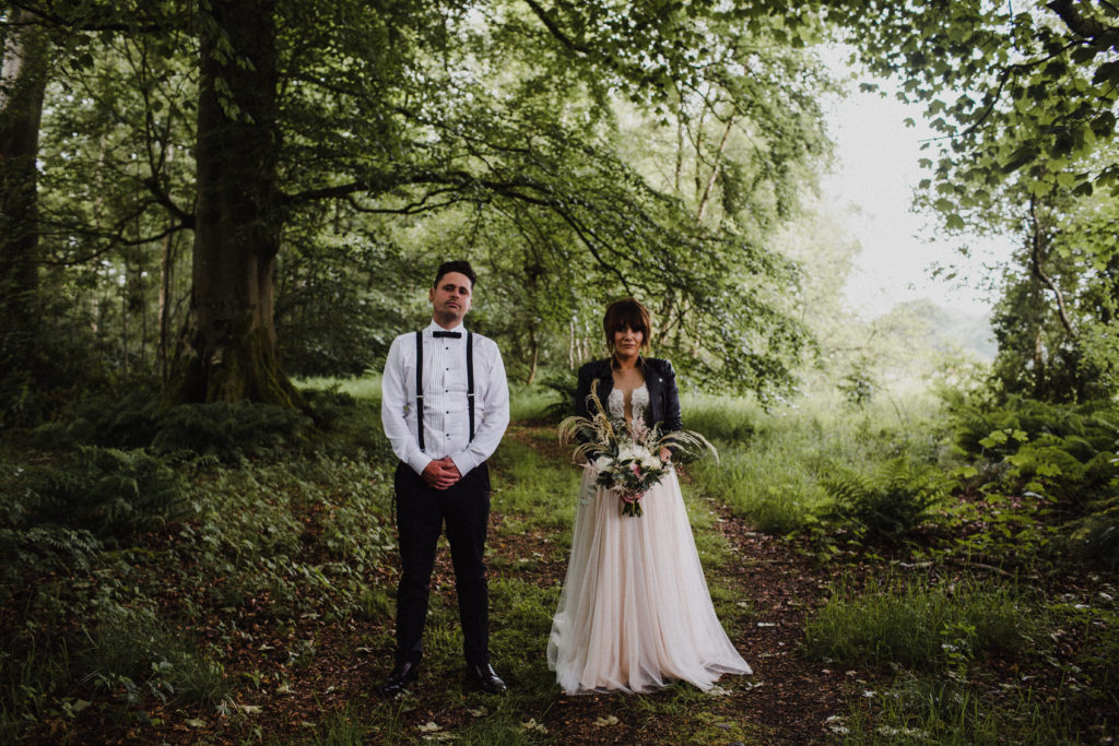 bride and groom standing in the woodland after their wedding at Boswell's Coach House in Ayrshire