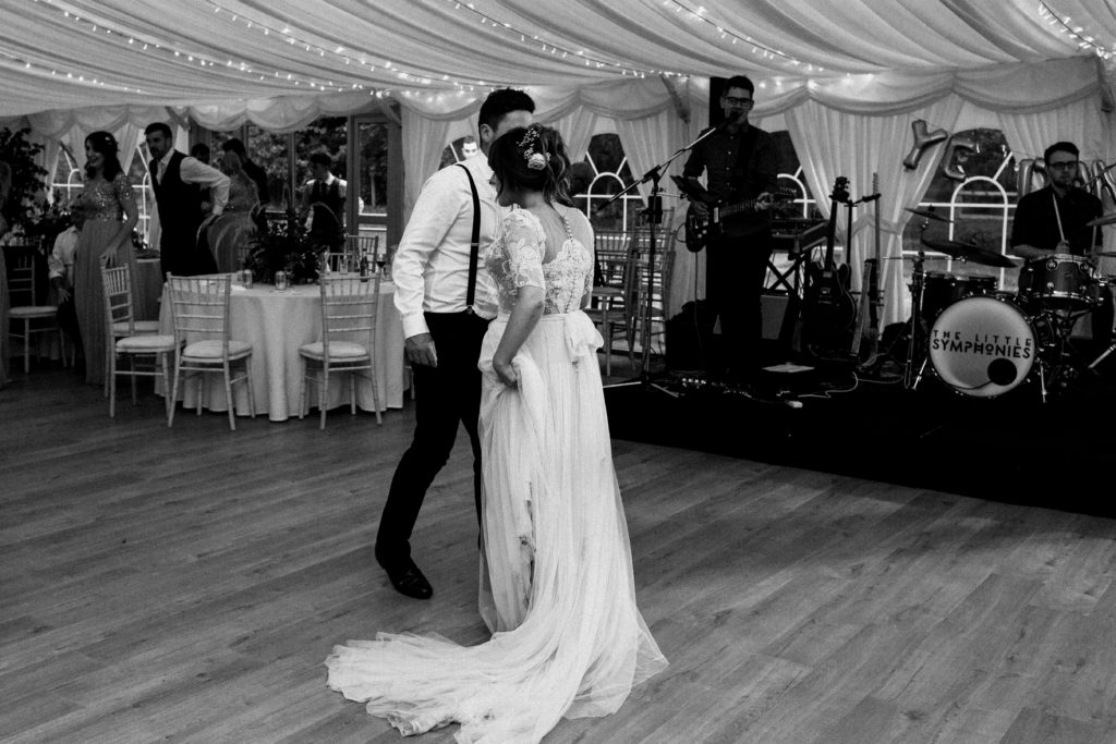 bride and groom do their first dance in front of the band at Boswell's Coach House Ayrshire