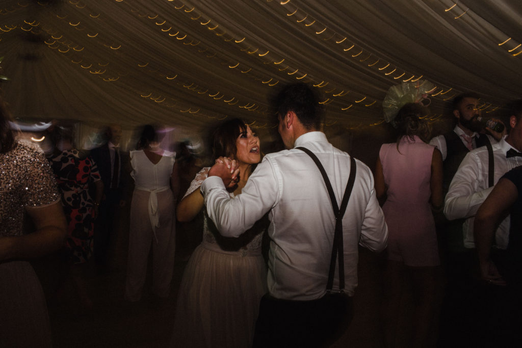 Bride and groom sing and dance at their wedding at Boswell's Coach House in Ayrshire