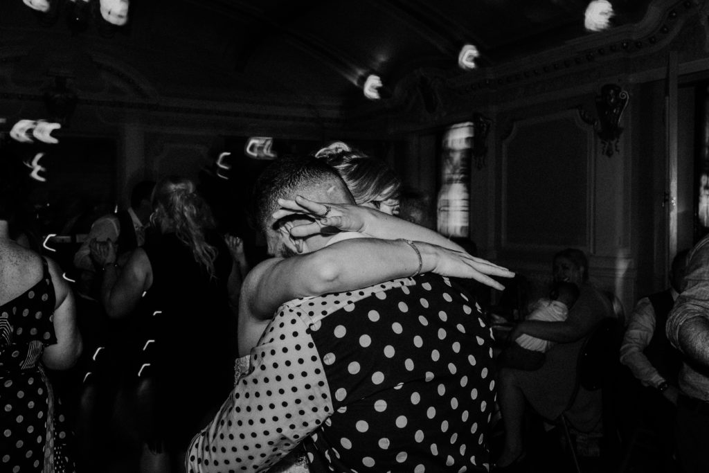 bride and groom hugging while dancing at wedding at Sloan's bar Glasgow
