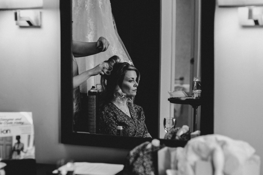 bride getting her hair done before her wedding at the Grand Central Hotel Glasgow