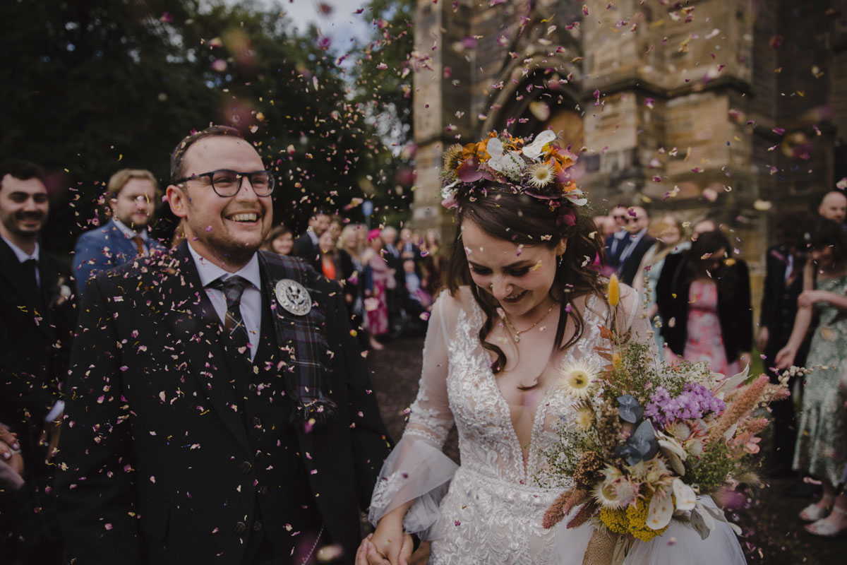 Close up of bride and groom during confetti throw at Cottiers Glasgow wedding