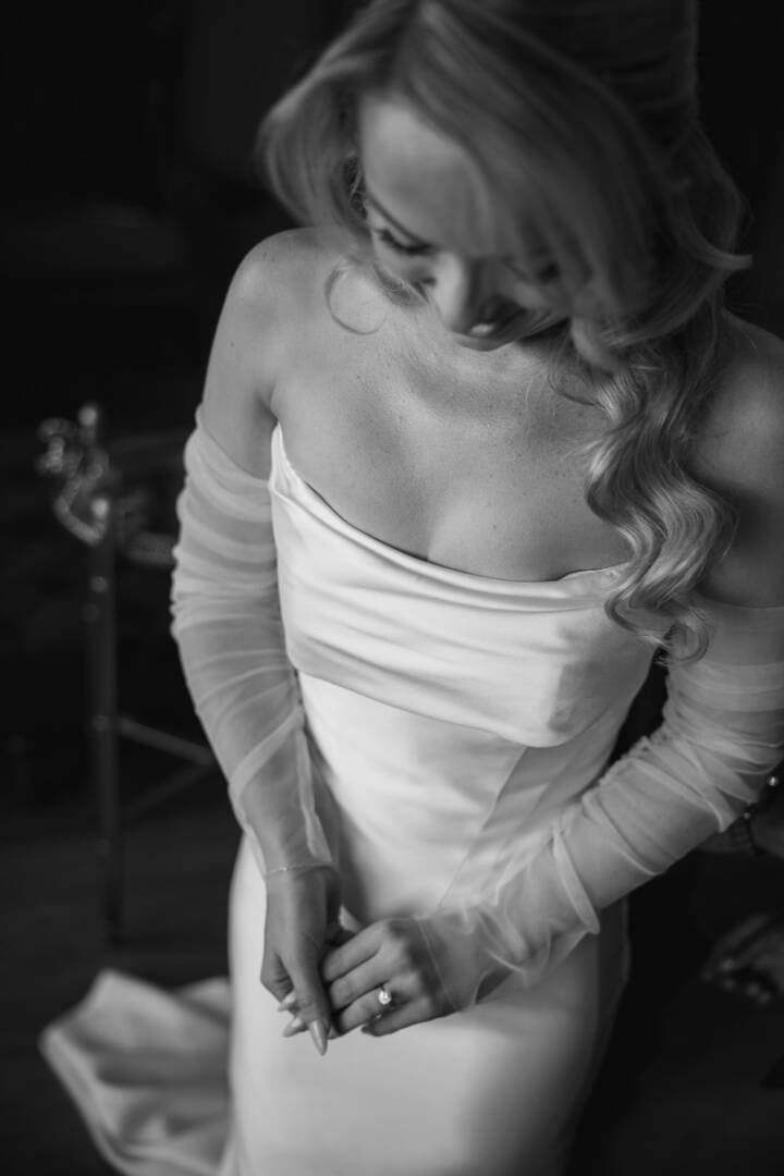 Bride preparing for her wedding in a relaxed, documentary style setting.